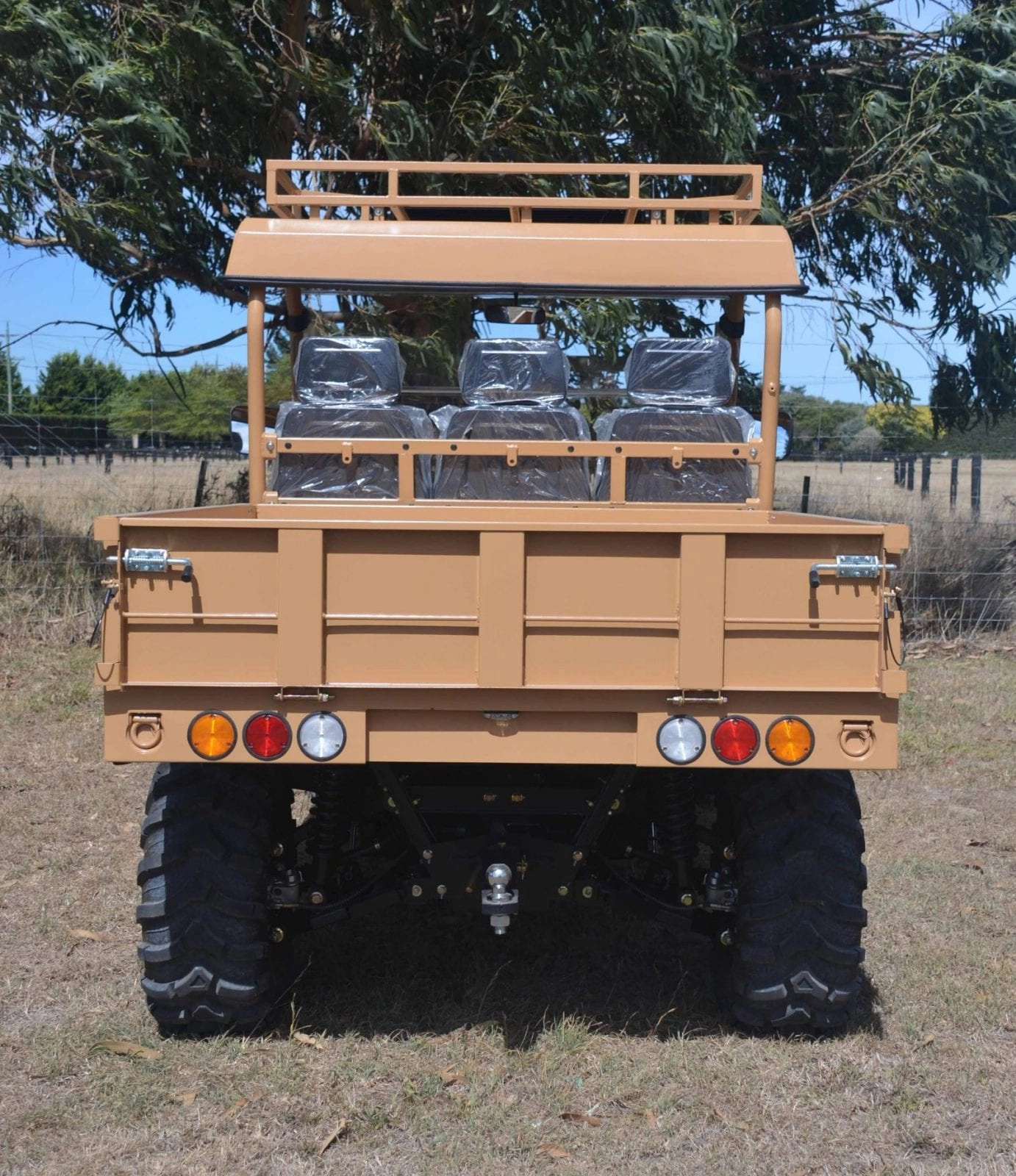A military vehicle with seats on the back.